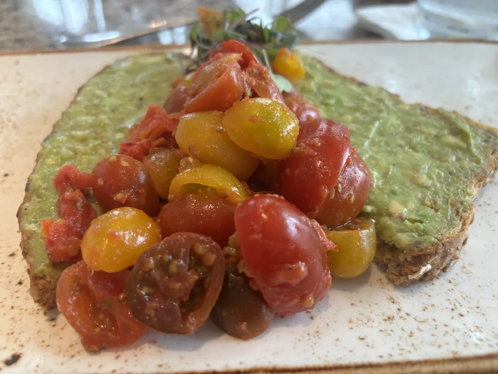 Avacado toast with fire roasted tomatoes